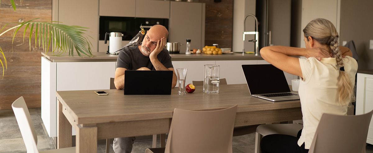 Stressed couple working from home, DiSC can help couples navigate stress