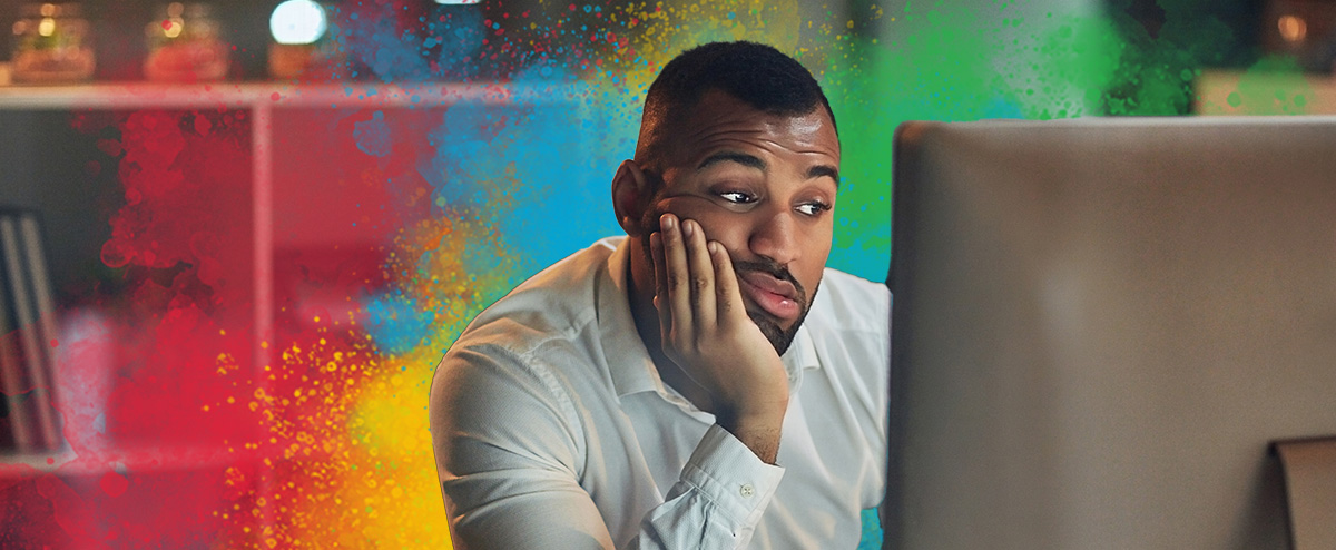 Man procrastinating at a computer