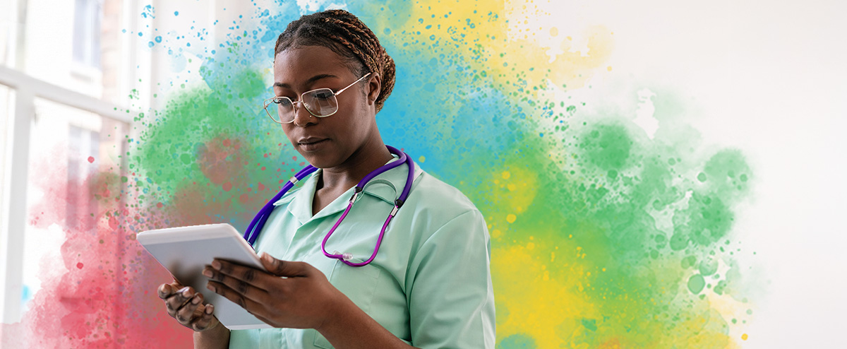 Health care worker reviewing list on tablet between patients to hold herself accountable at work
