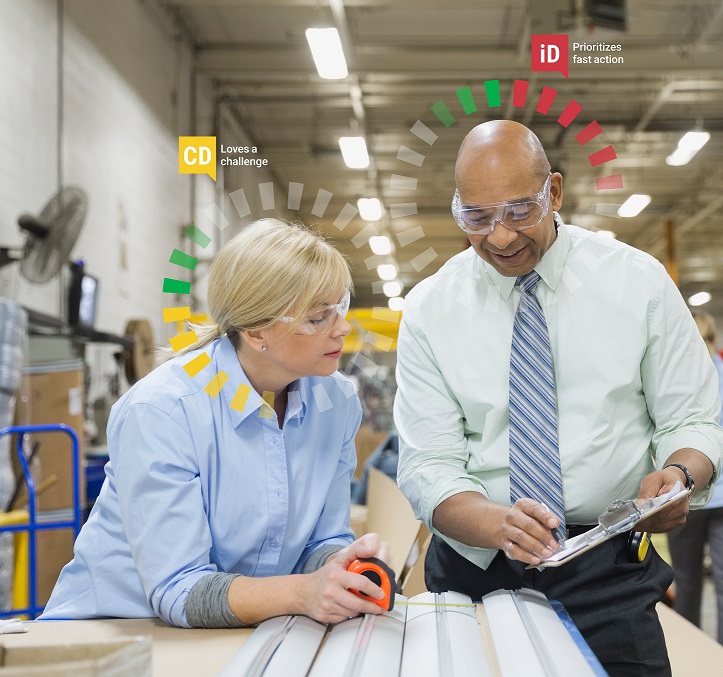 Manager with staff person on shop floor